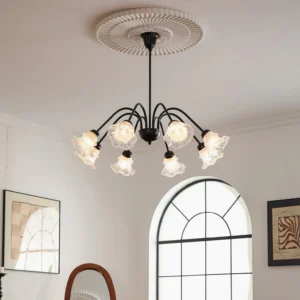 Modern botanical chandelier installed in French-style living room with ceiling medallion and warm ambient lighting