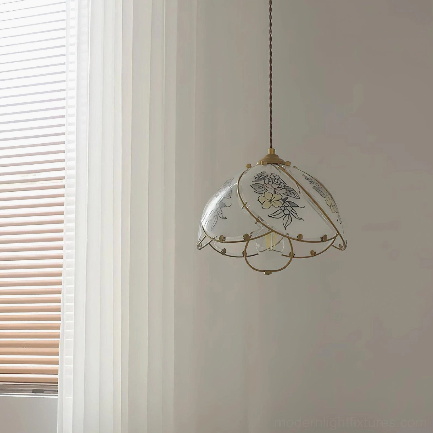 Elegant lily botanical pendant fixture, close-up of opal glass shade with engraved floral details