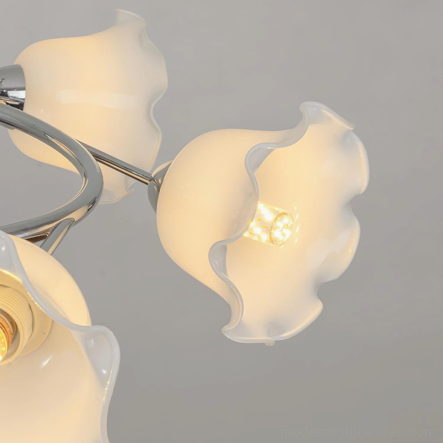 Lily Cascade contemporary ceiling light fixture showing polished chrome spiral construction and petal design