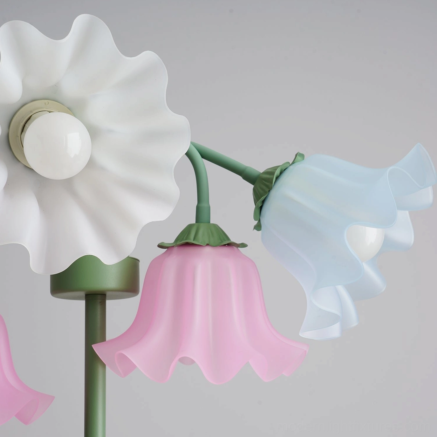 Detailed macro view of multicolor pastel bell-shaped flower designs on lily of the valley lamp