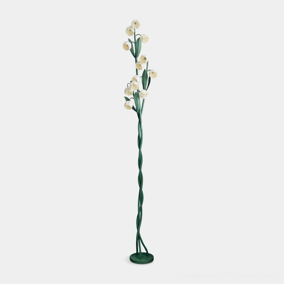 Lily of the valley floor lamp with three green spiral stems and white flower-shaped acrylic lampshades, front view studio shot