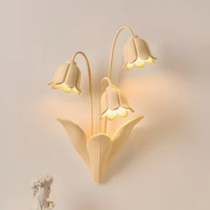 Lily of the Valley Wall Sconce Illuminated - Warm Beige Resin Botanical Light Fixture Studio Shot