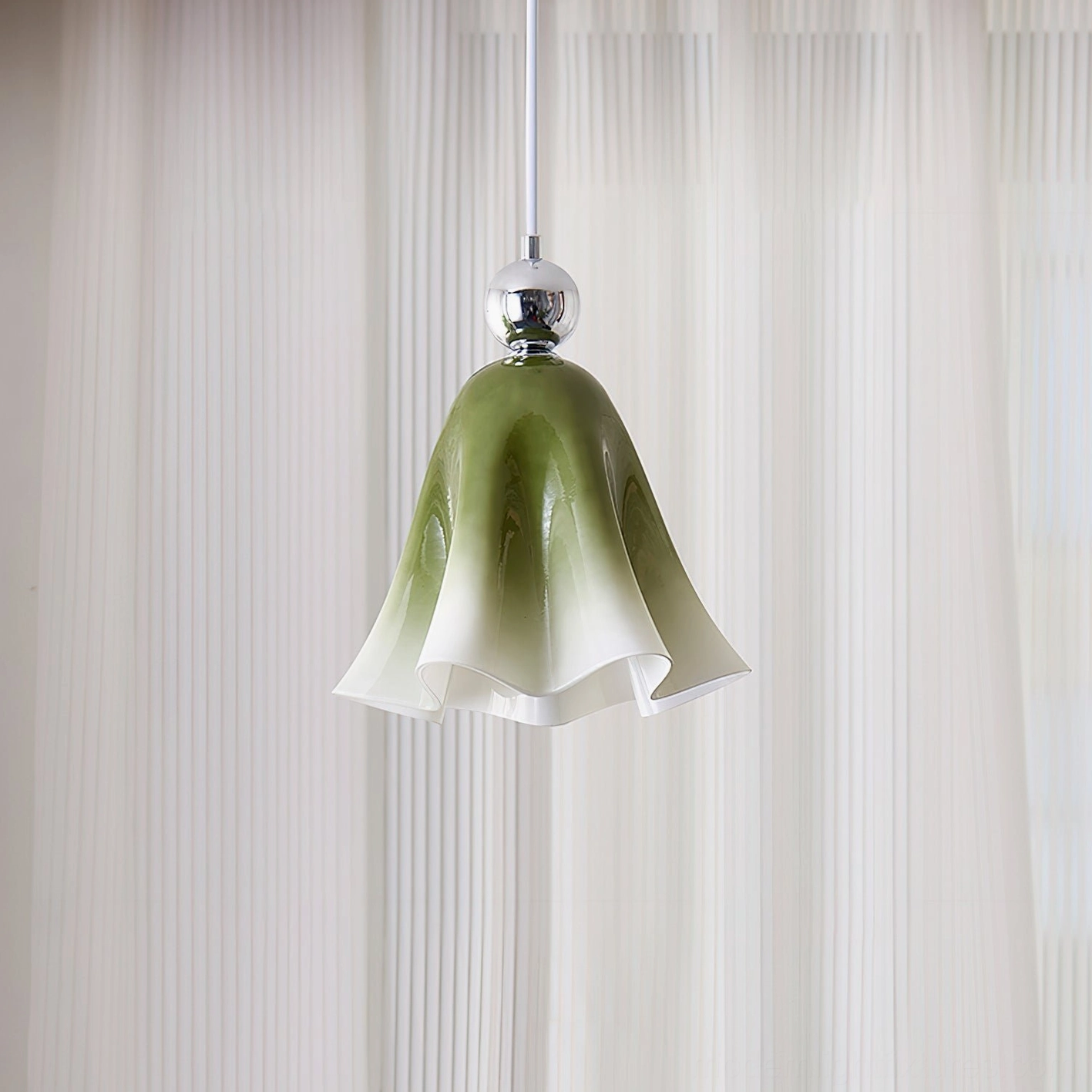 Vellia pendant light fixture close-up chrome metal accent sphere glass shade detail