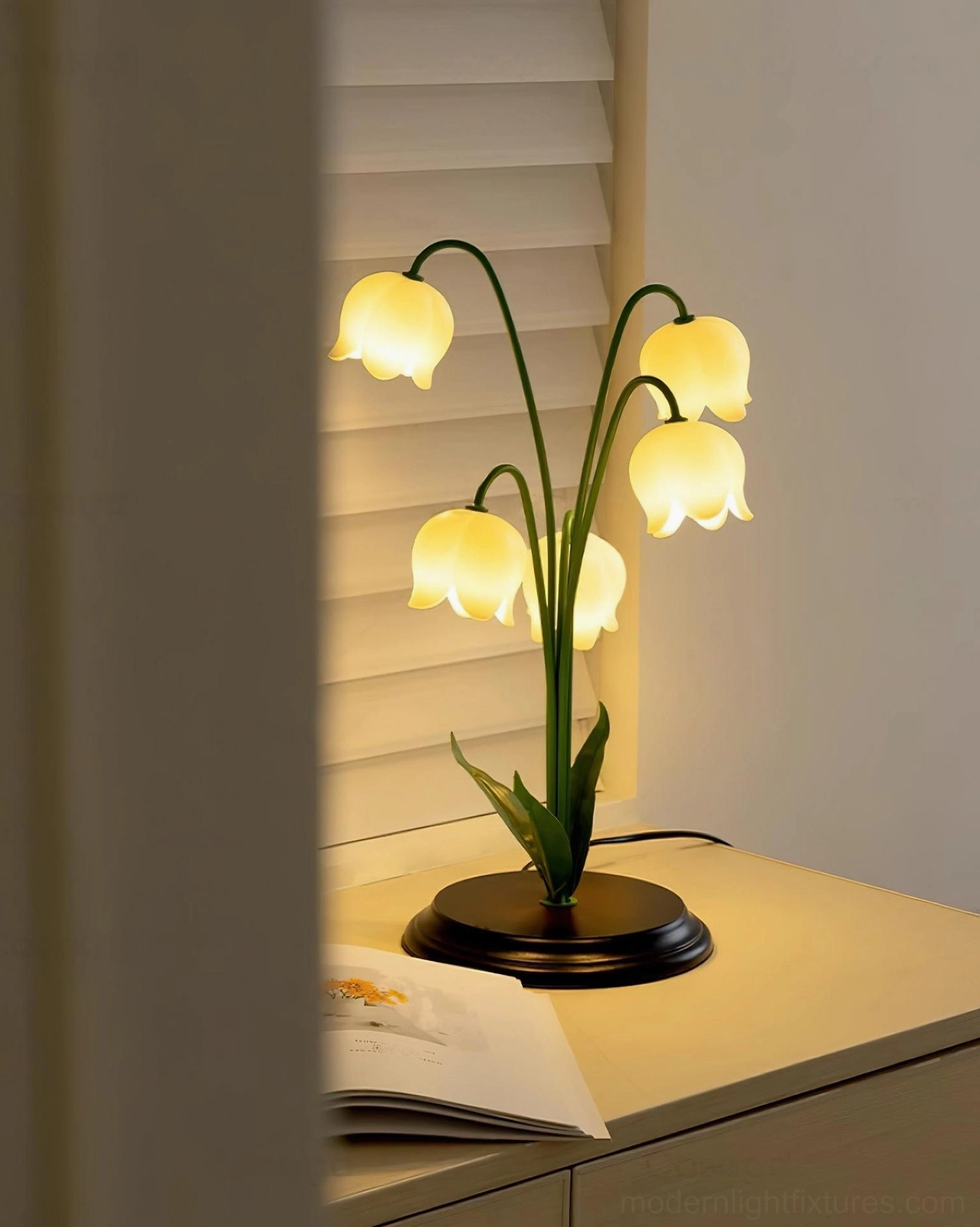 Lily of the Valley table lamp on bedroom nightstand with warm ambient lighting