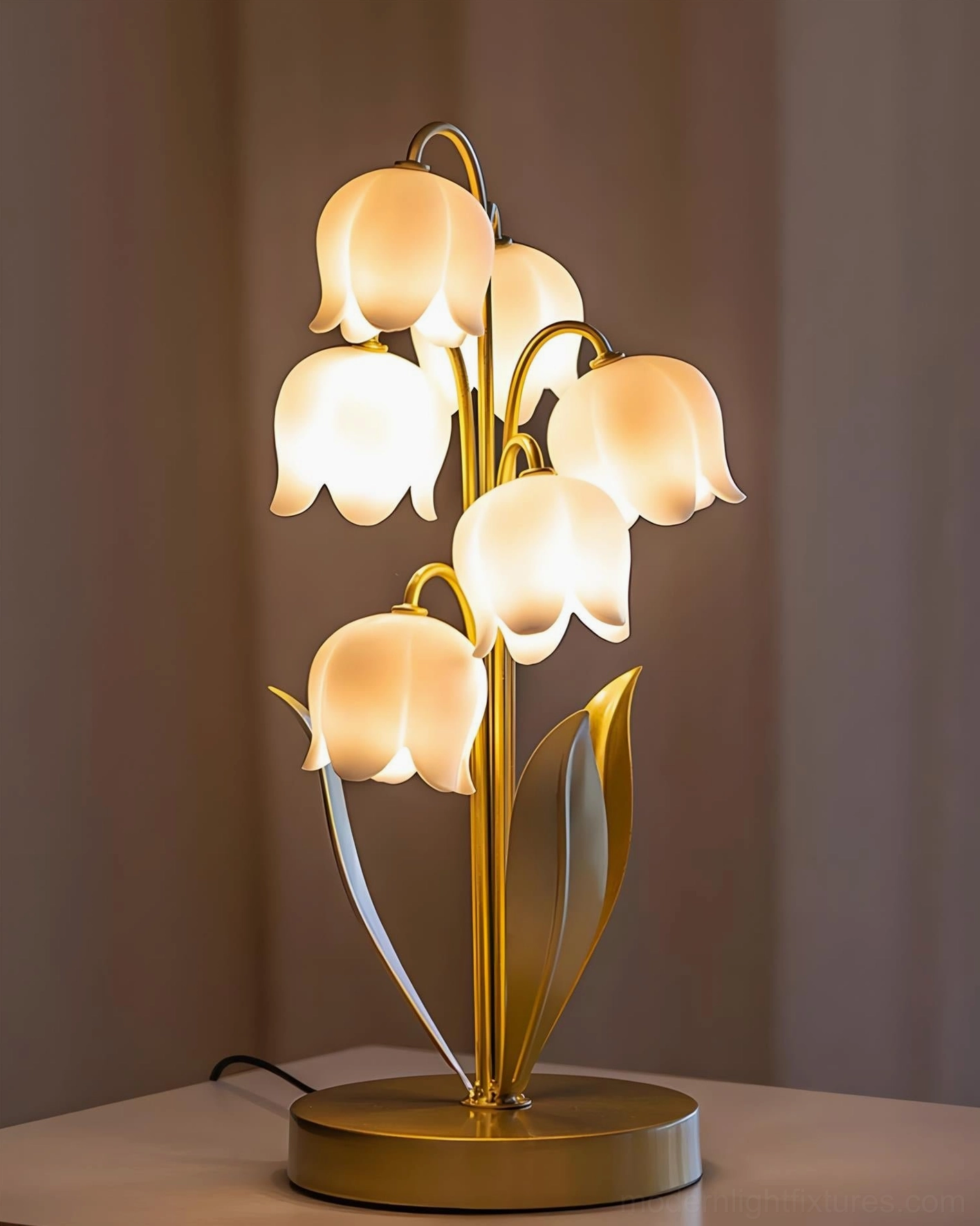 Contemporary botanical table lamp with lily of the valley design showing green metal frame and white frosted acrylic flower-shaped shades
