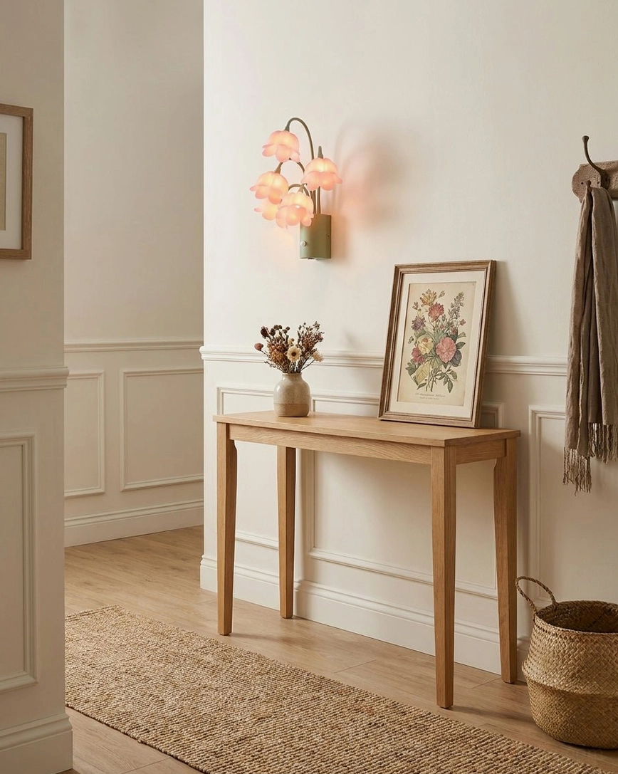 USB-rechargeable motion-sensor lily-of-the-valley sconce with warm glow in traditional hallway with wainscoting and wooden console table