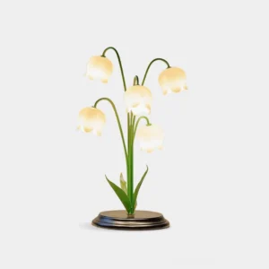 Lily of the Valley white flower table lamp with green stems and black base, front studio view