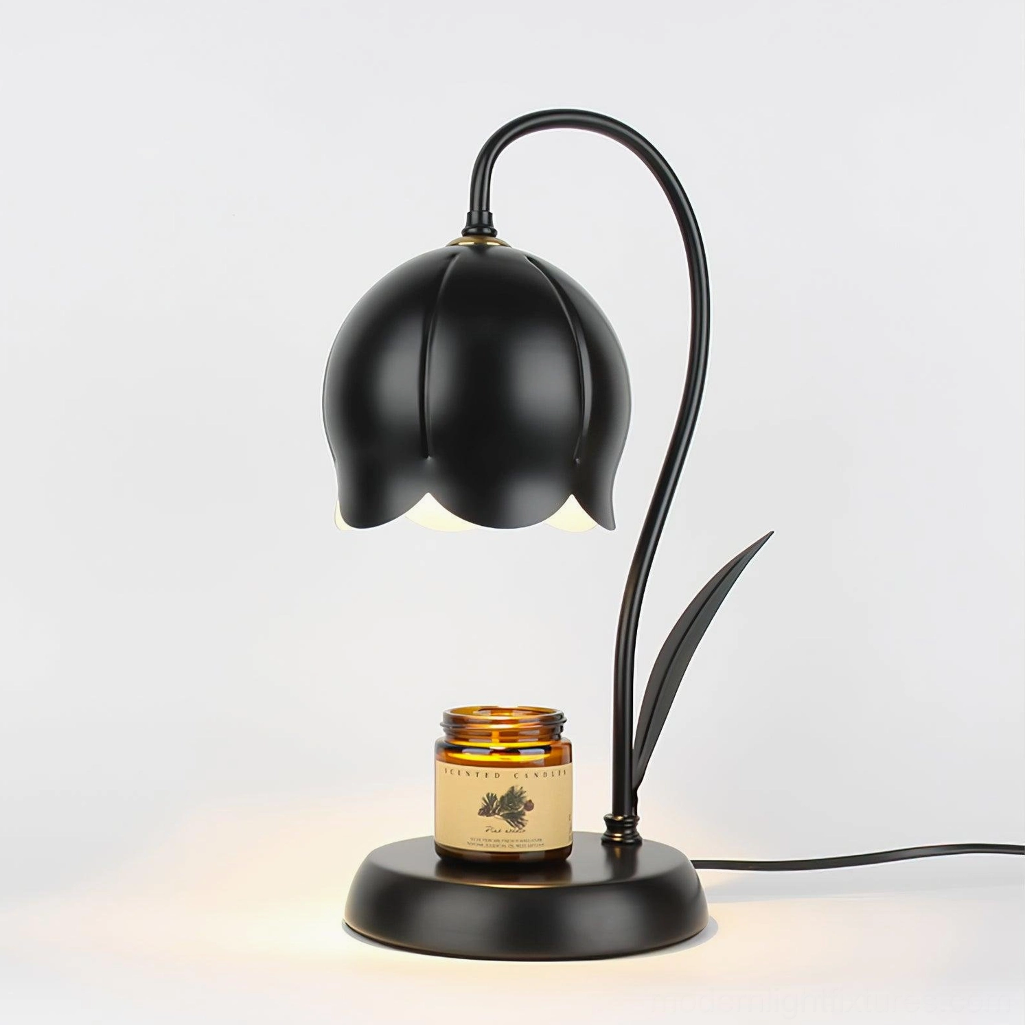 Sculptural lily wax melting lamp in minimalist home office setting with plants and modern decor