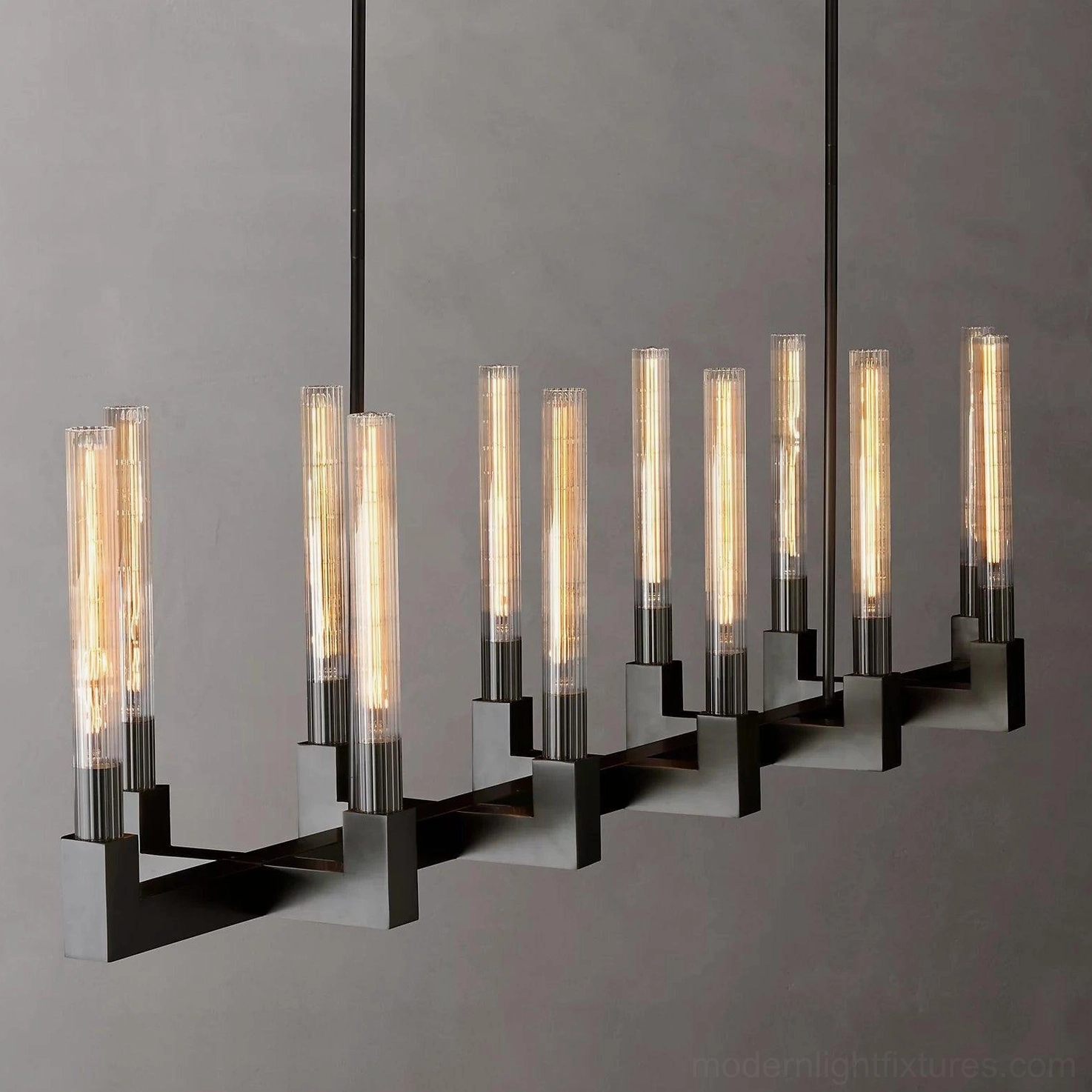 Linear chandelier 140cm brass construction geometric precision modern minimalist