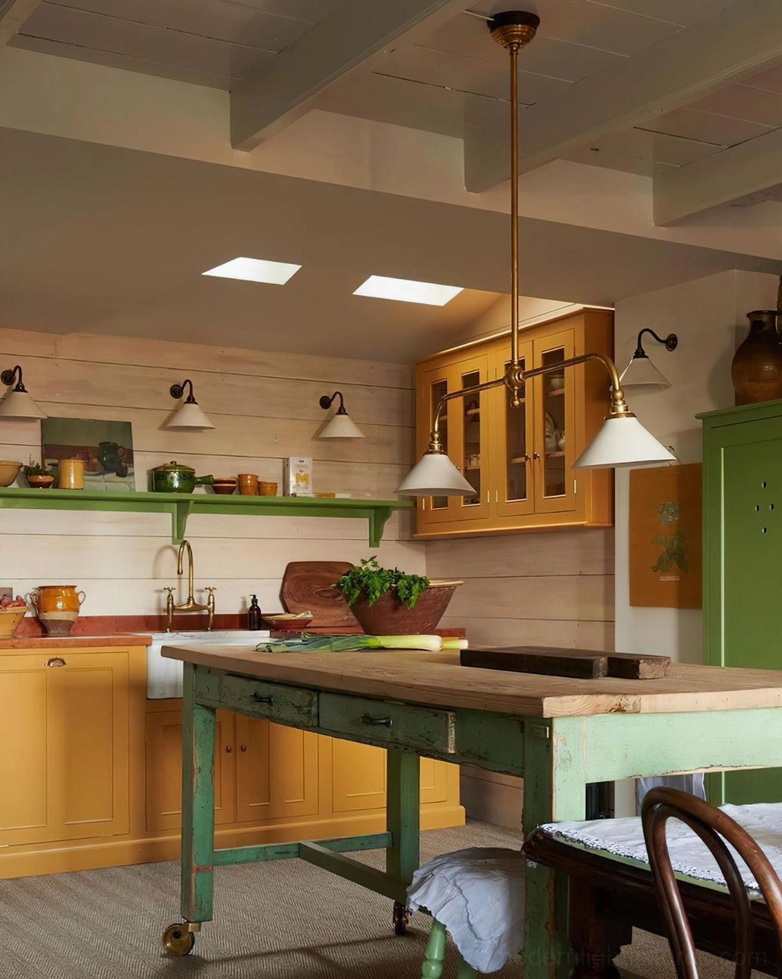 Modern brass frame linear chandelier with ceramic shades positioned above island countertop in contemporary kitchen design
