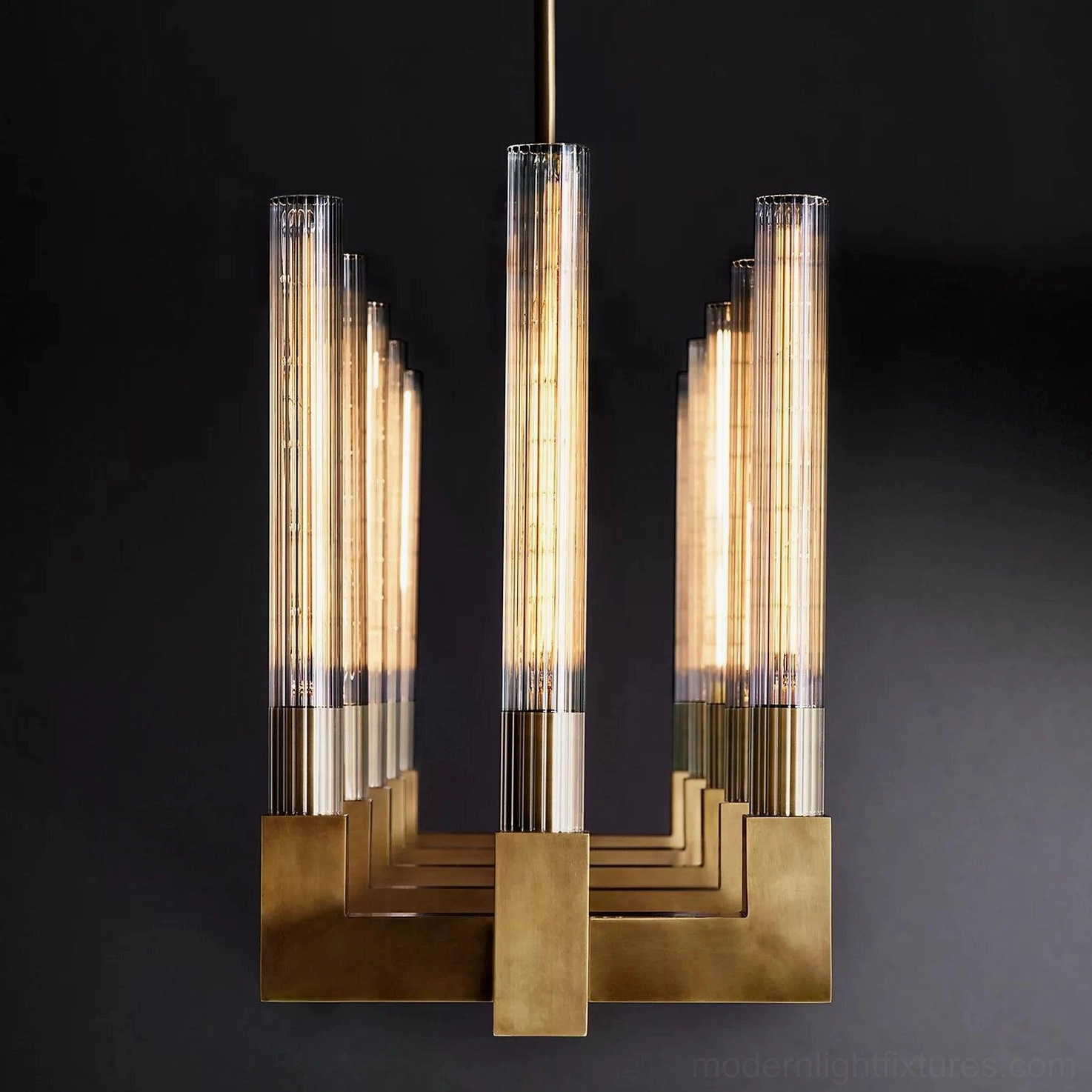 Contemporary linear chandelier kitchen island installation brass finish accent lighting