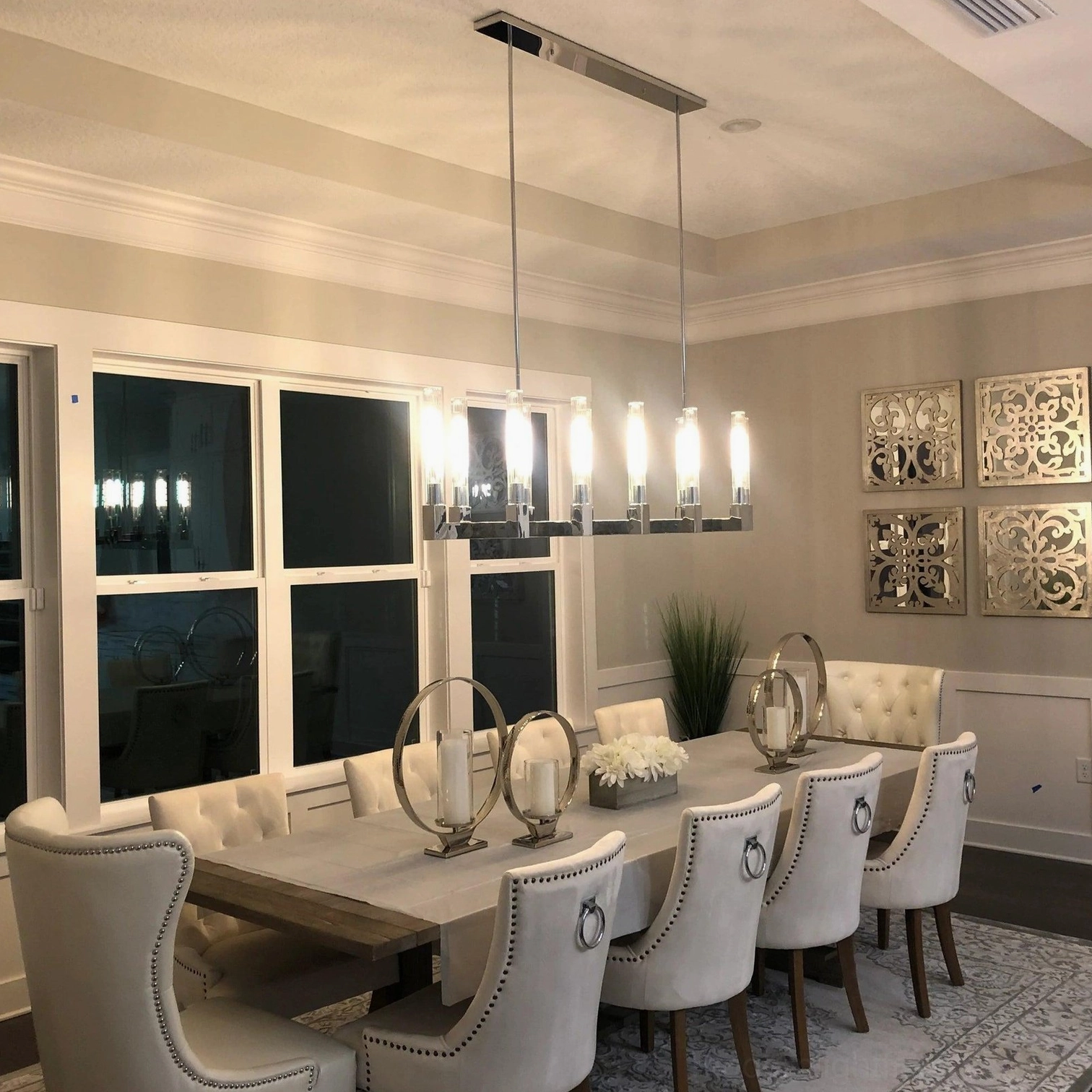 Modern linear chandelier upscale restaurant installation brass hardware geometric form