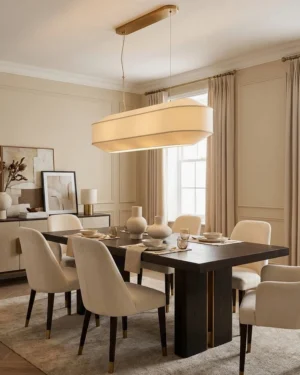 Elvara linear pendant chandelier installed above dining table in contemporary dining room with warm minimalist interior design
