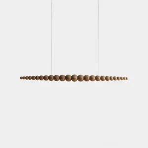 Modern linear LED chandelier with integrated warm white light and wooden bead accent, front studio view