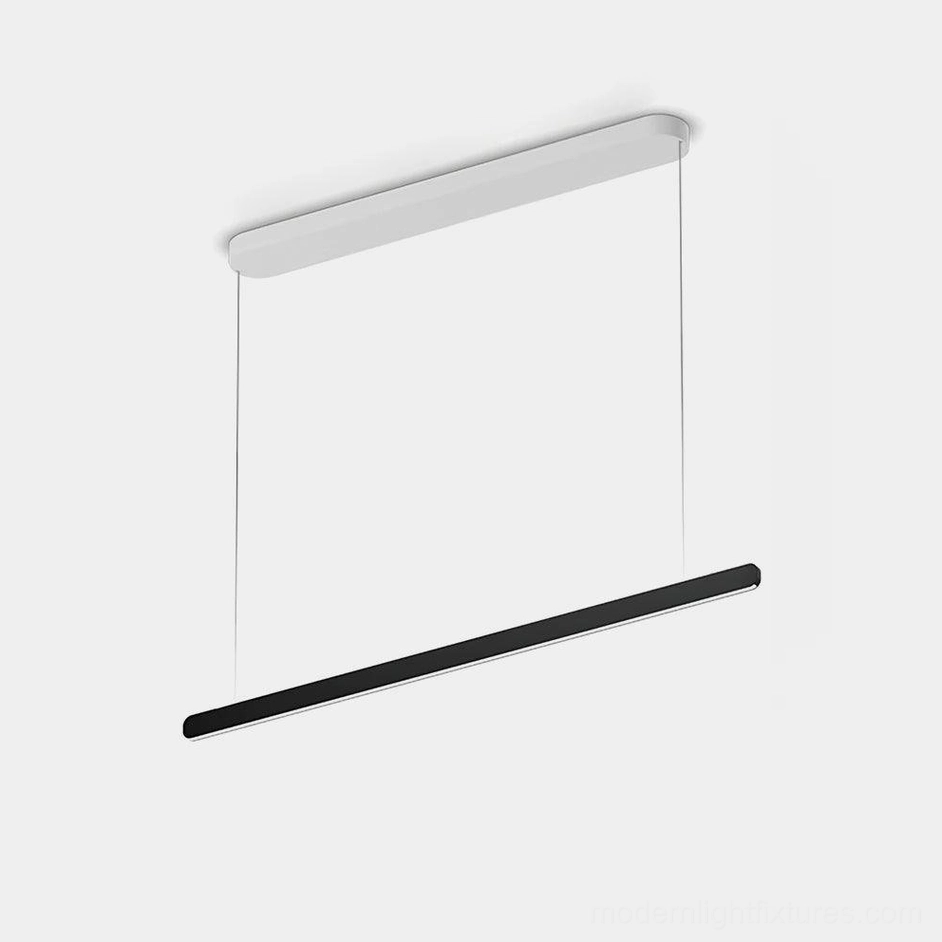 Modern linear LED pendant light with dual-tone matte aluminum finish in studio setting