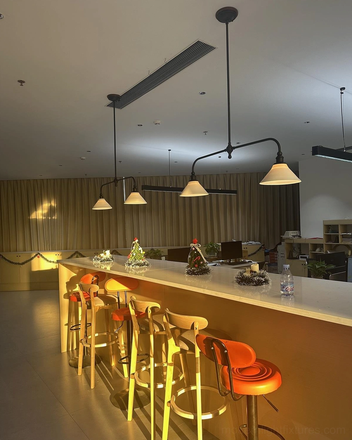 Linear pendant chandelier featuring brass construction and opal ceramic shades with early 20th-century craftsmanship inspiration