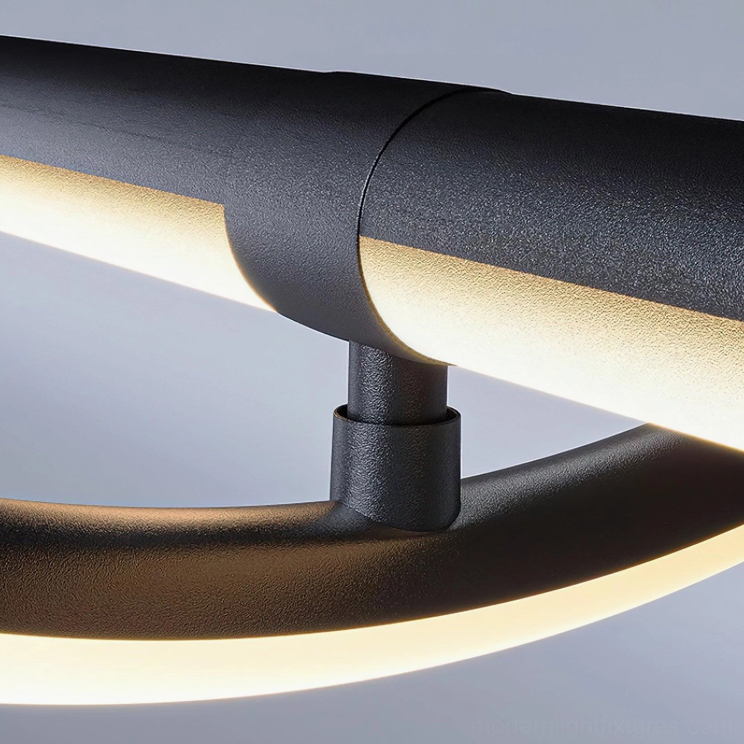 Modern linear pendant fixture with sloped ceiling compatible design in architecturally advanced home space