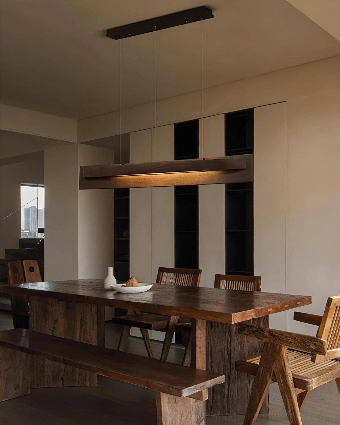 Linear wood pendant light large dining space warm walnut minimalist design