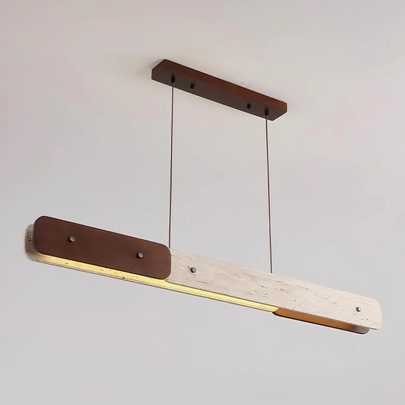 Linero linear chandelier low angle view - warm white LED integrated lighting with travertine detail