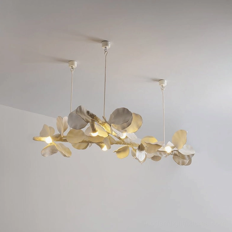 Liria Linear Chandelier product shot showing full ivory-white hand-carved leaf arrangement with warm light emission