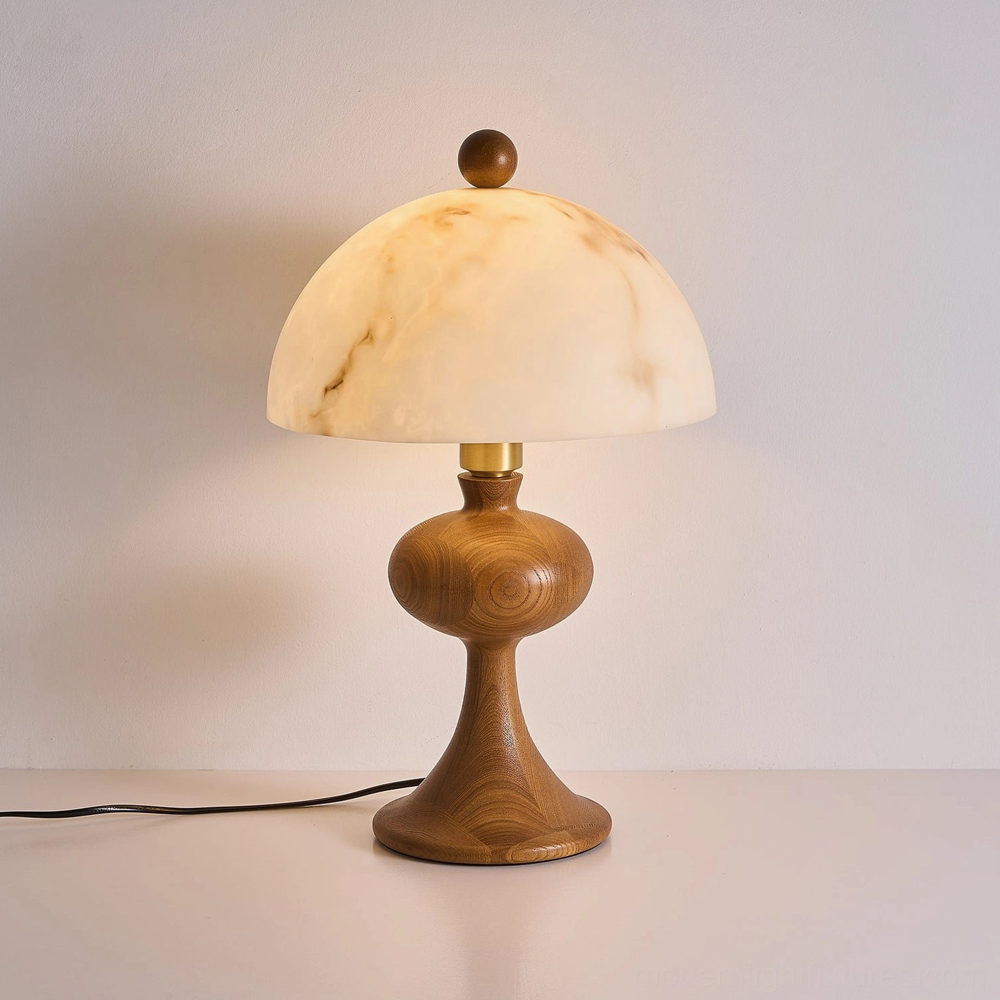 Illuminated faux alabaster dome shade on wood table lamp, warm glow demonstrating light diffusion and ambient illumination