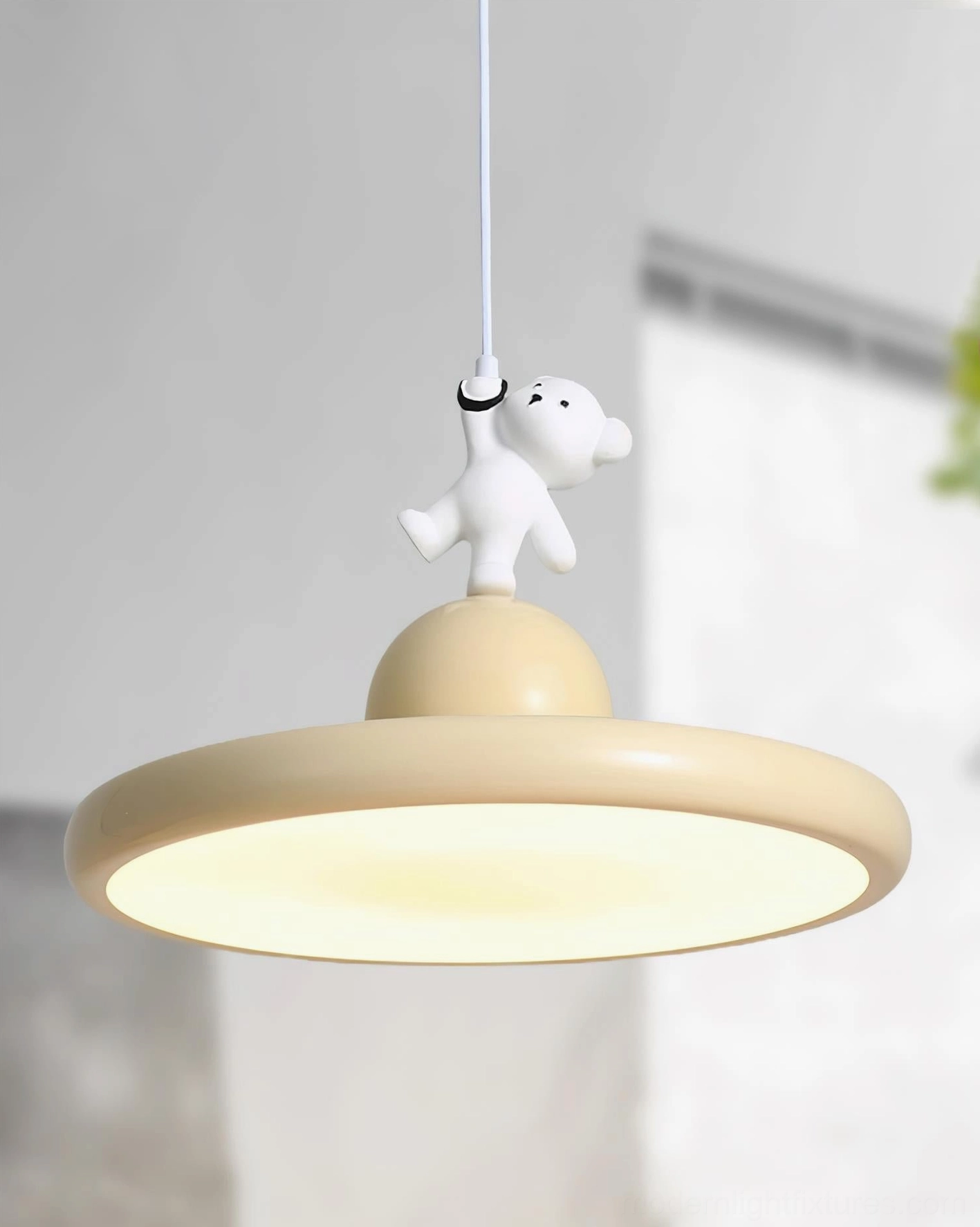 Illuminated bear pendant light front view, modern resin hanging lamp glowing warm yellow creating cozy ambiance
