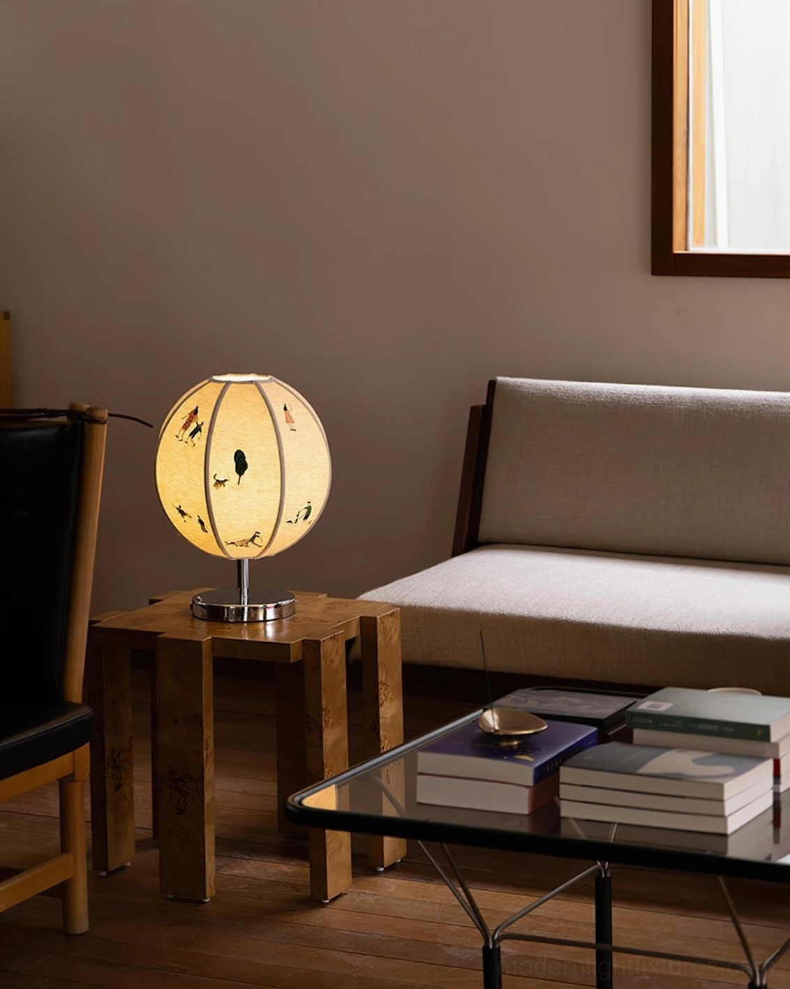 Lit embroidered table lamp creating warm ambient glow on wooden side table in cozy living room setting