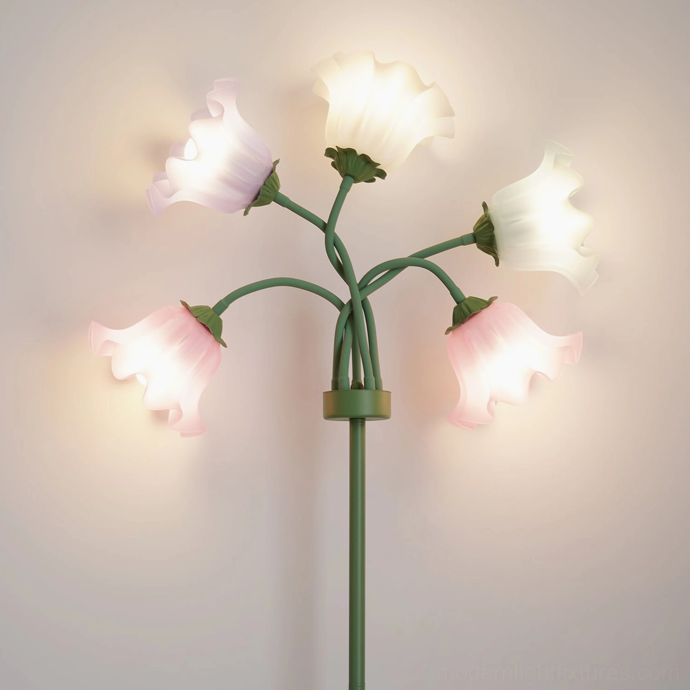 Illuminated multicolor pastel lily of the valley floor lamp with glowing bell shades on warm neutral backdrop