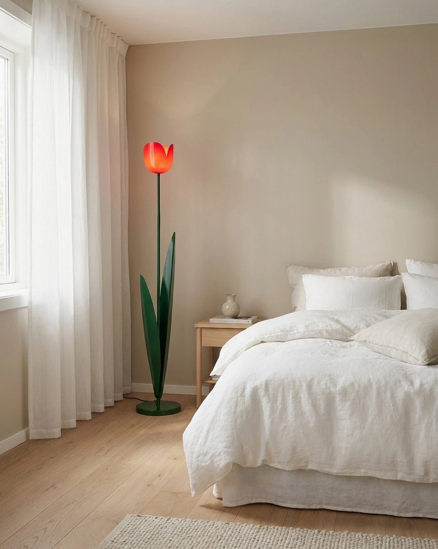 Lit red tulip floor lamp glowing in minimalist Nordic bedroom with white bedding – botanical floor lamp ambient lighting