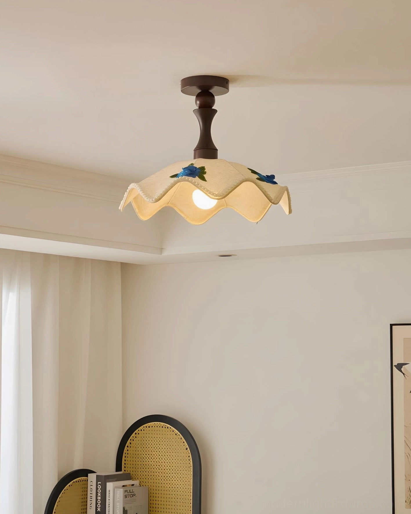 Illuminated wavy fabric ceiling lamp with warm glowing light, dark wood fixture, and scalloped shade detail in residential room