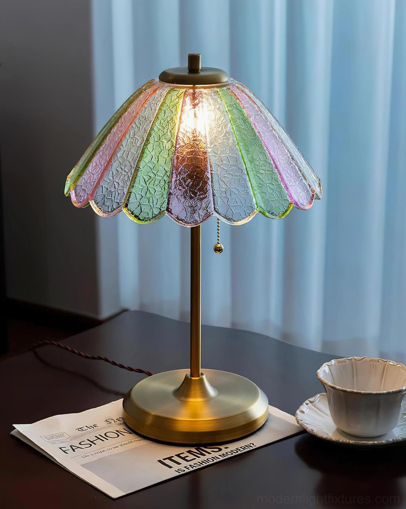 Lit vintage scalloped glass table lamp with brass base creating ambient home lighting