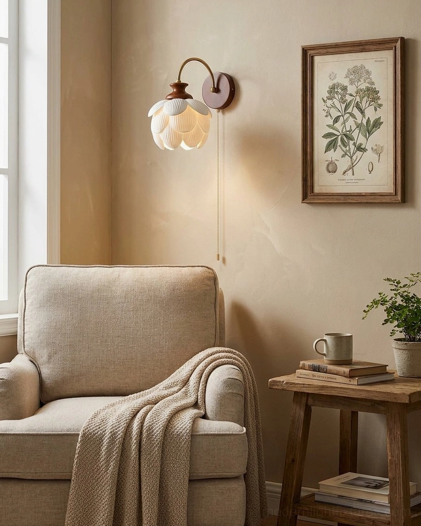 Petal wall sconce mounted in living room corner with armchair and botanical wall art in warm minimalist interior design