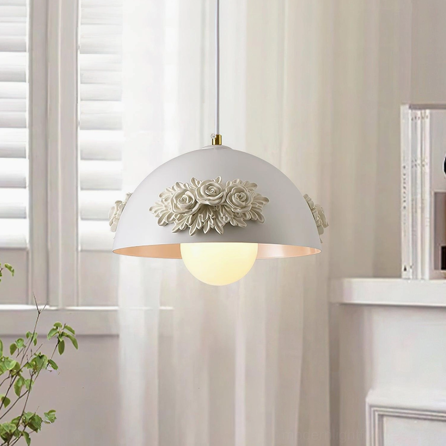 Single floral pendant lamp in living area near louvered window with sheer curtains, warm cozy romantic home lighting atmosphere