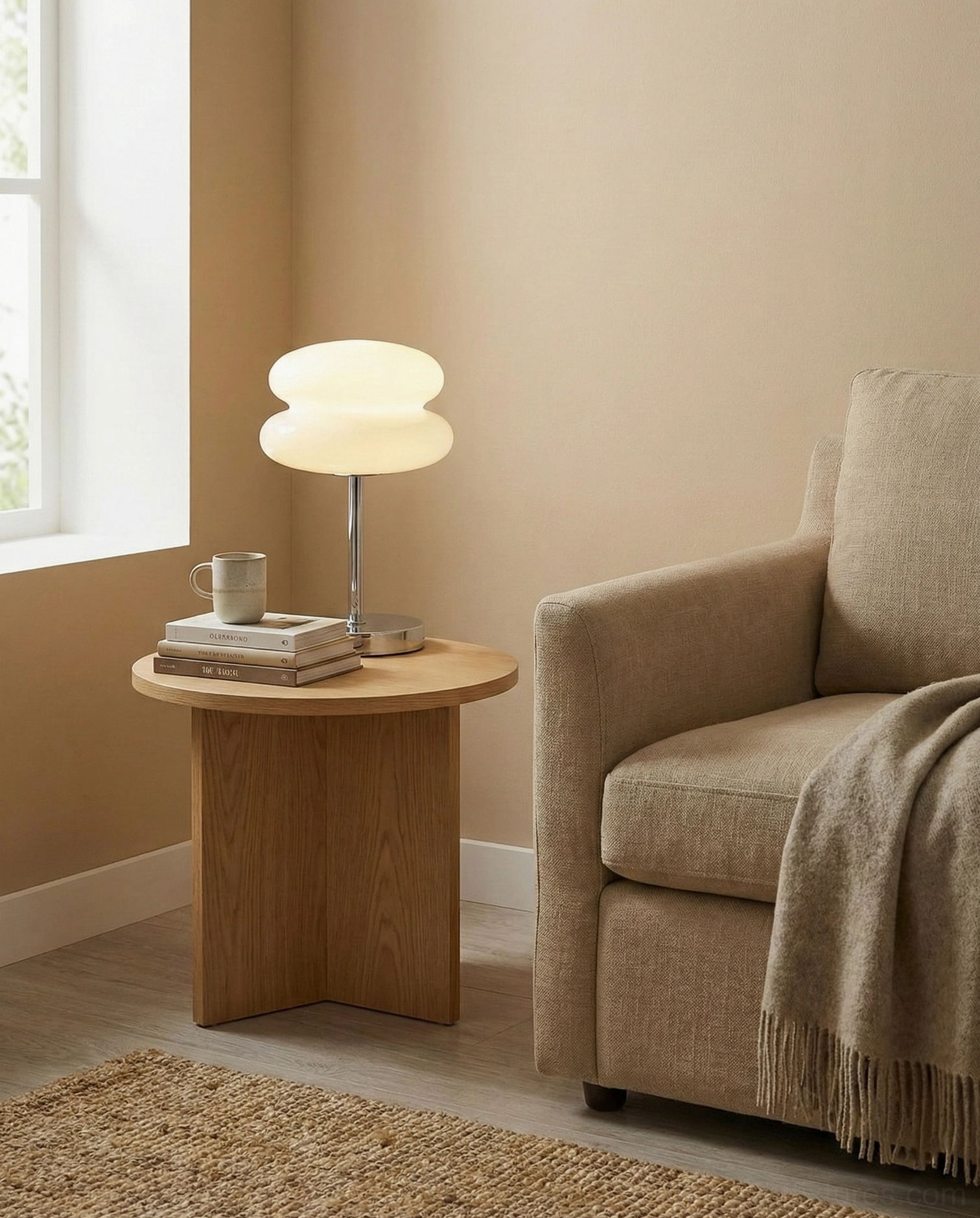 Contemporary glass table lamp on wooden side table next to sofa in modern living room