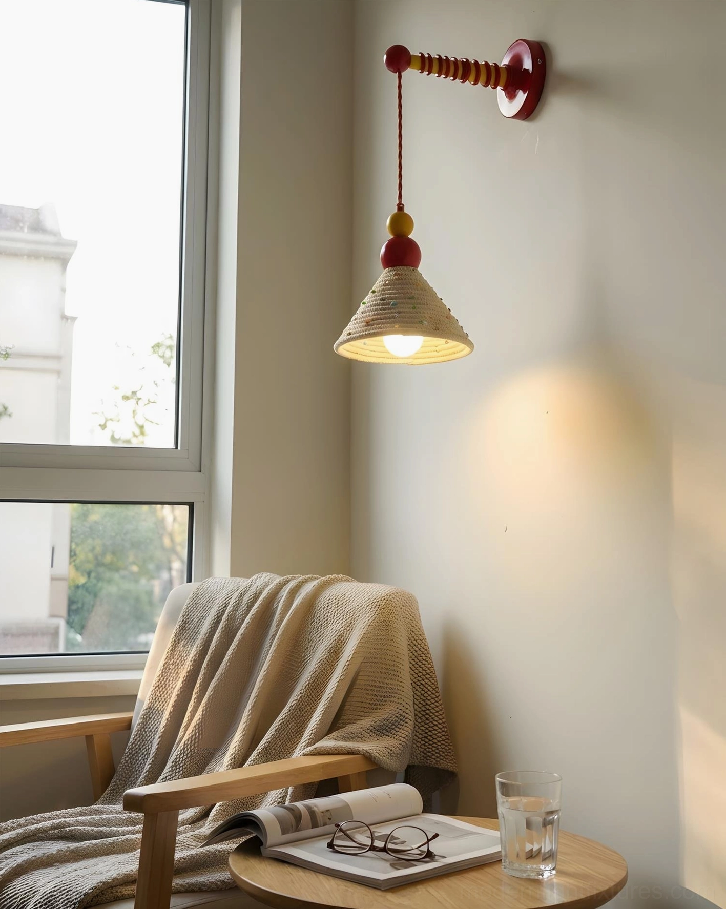 Modern colorful wall sconce mounted beside living room window with illuminated woven fabric shade and warm lighting