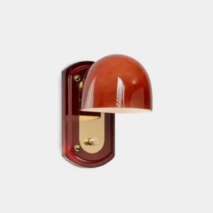 Lolita modern dome wall sconce in gold finish with glossy metal shade and polished backplate, front studio view