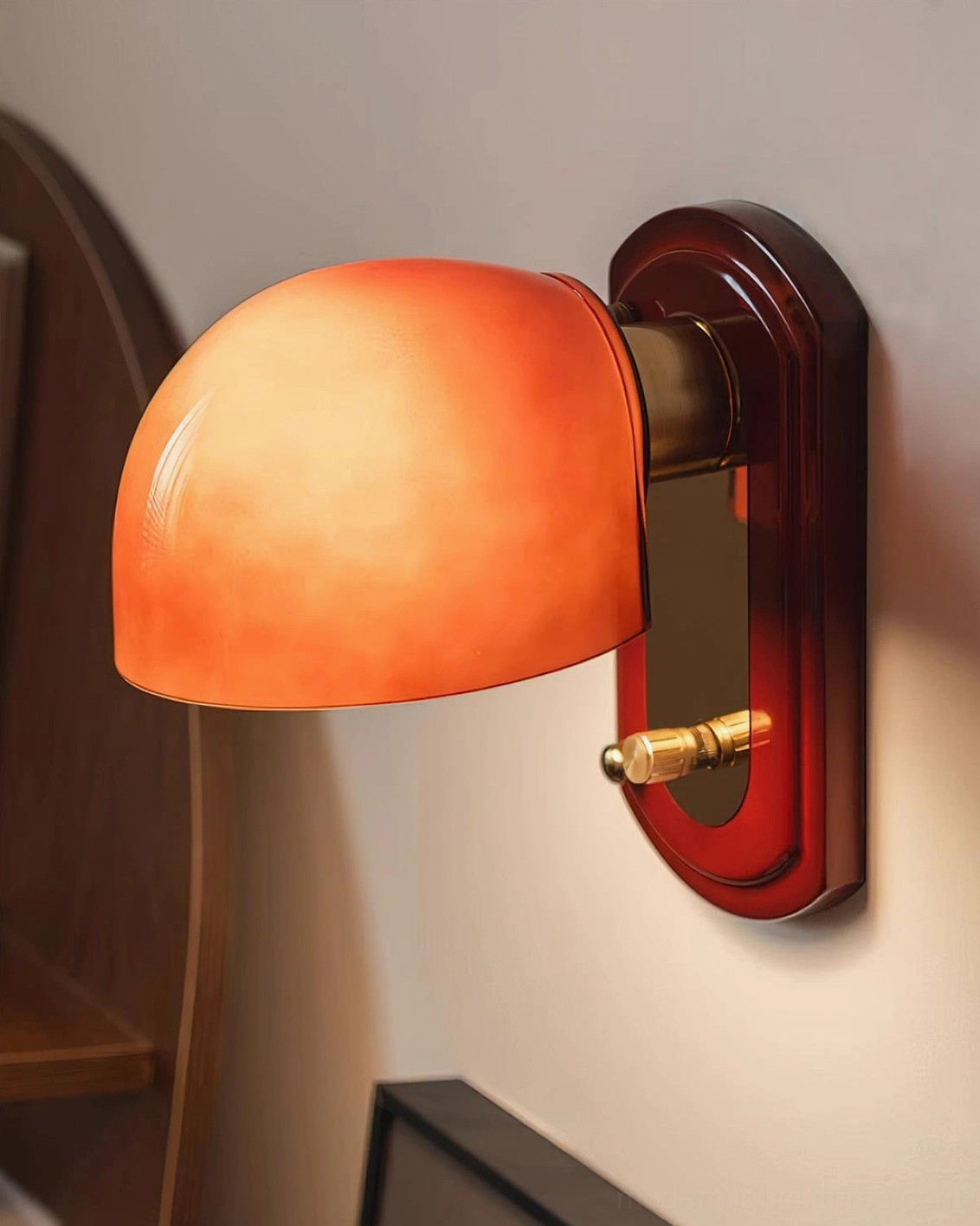 Lolita wall sconce installed above bedroom headboard providing warm reading light and freeing nightstand space