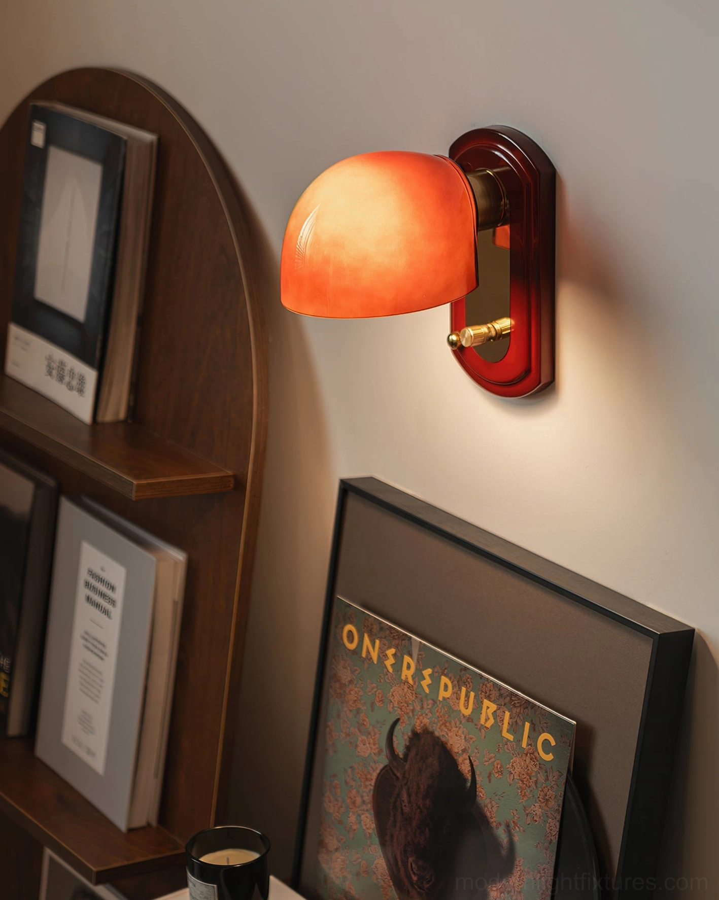 Lolita wall lamp installed in home reading nook beside bookshelf, eye-level lighting for modern bedroom