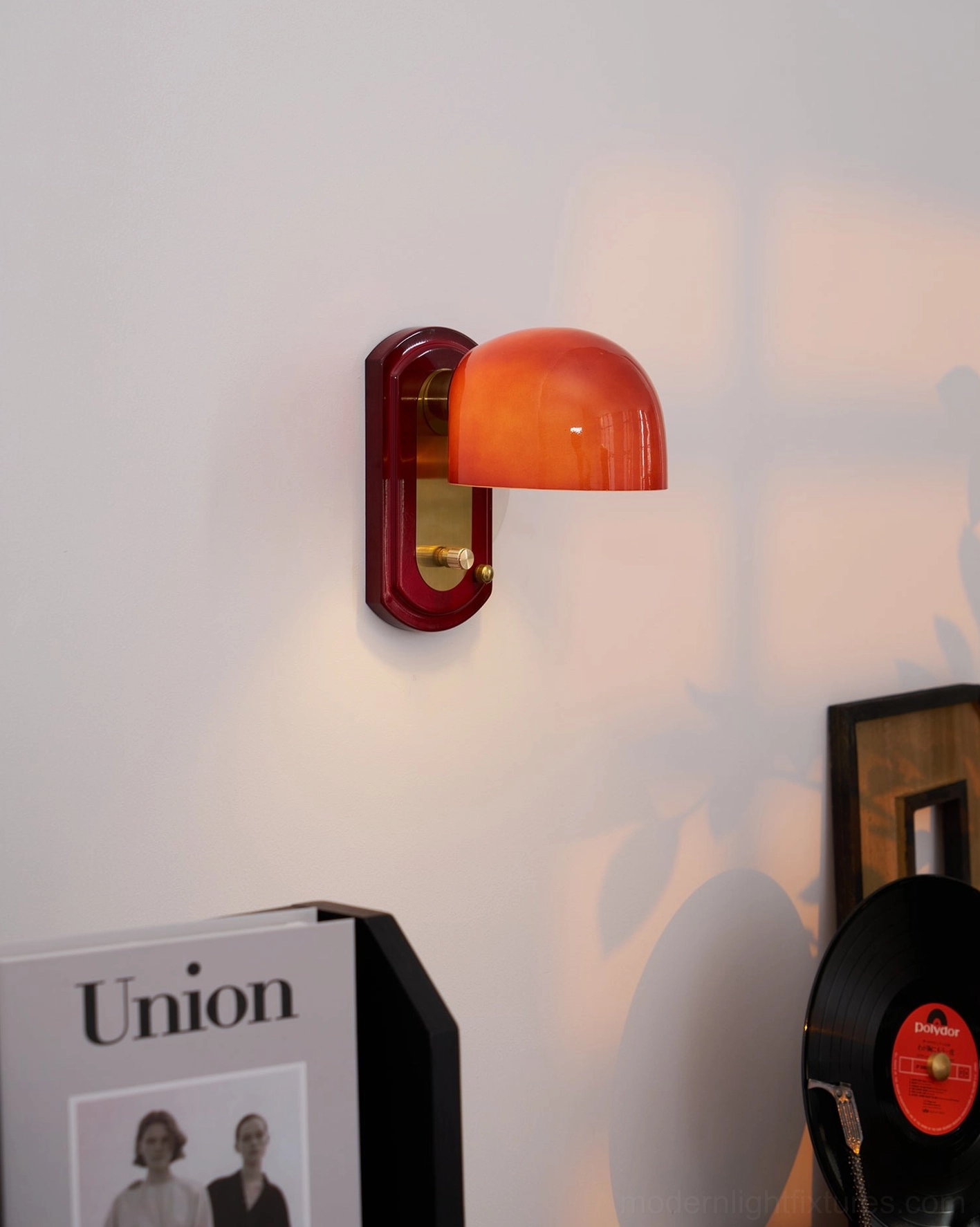 Lolita wall sconce installed on porch covered area, damp-rated weather-resistant outdoor lighting option