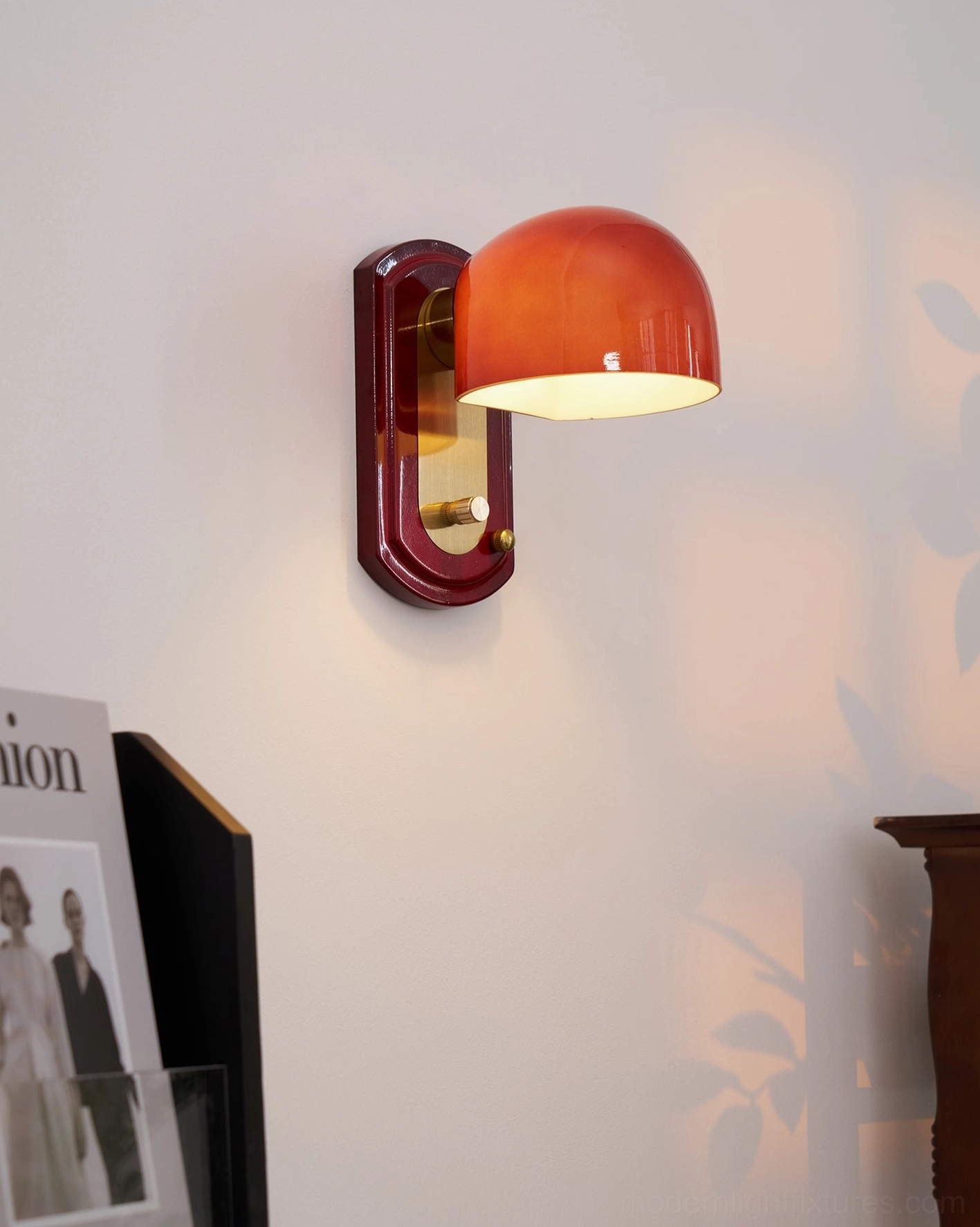 Lolita wall sconce in industrial chic space with exposed brick and metal accents complementing fixture design