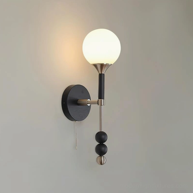 Lolli plug-in wall sconce with sculptural orb shade and geometric metal framework