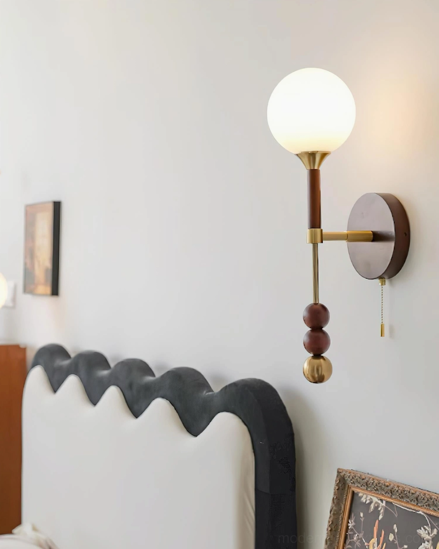 Lolli plug-in wall lamp with natural wood body and metal accents creating sophisticated home lighting