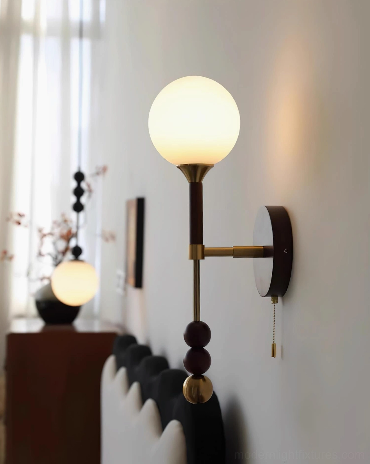 Lolli wall sconce mounted in modern interior space demonstrating sculptural lighting design