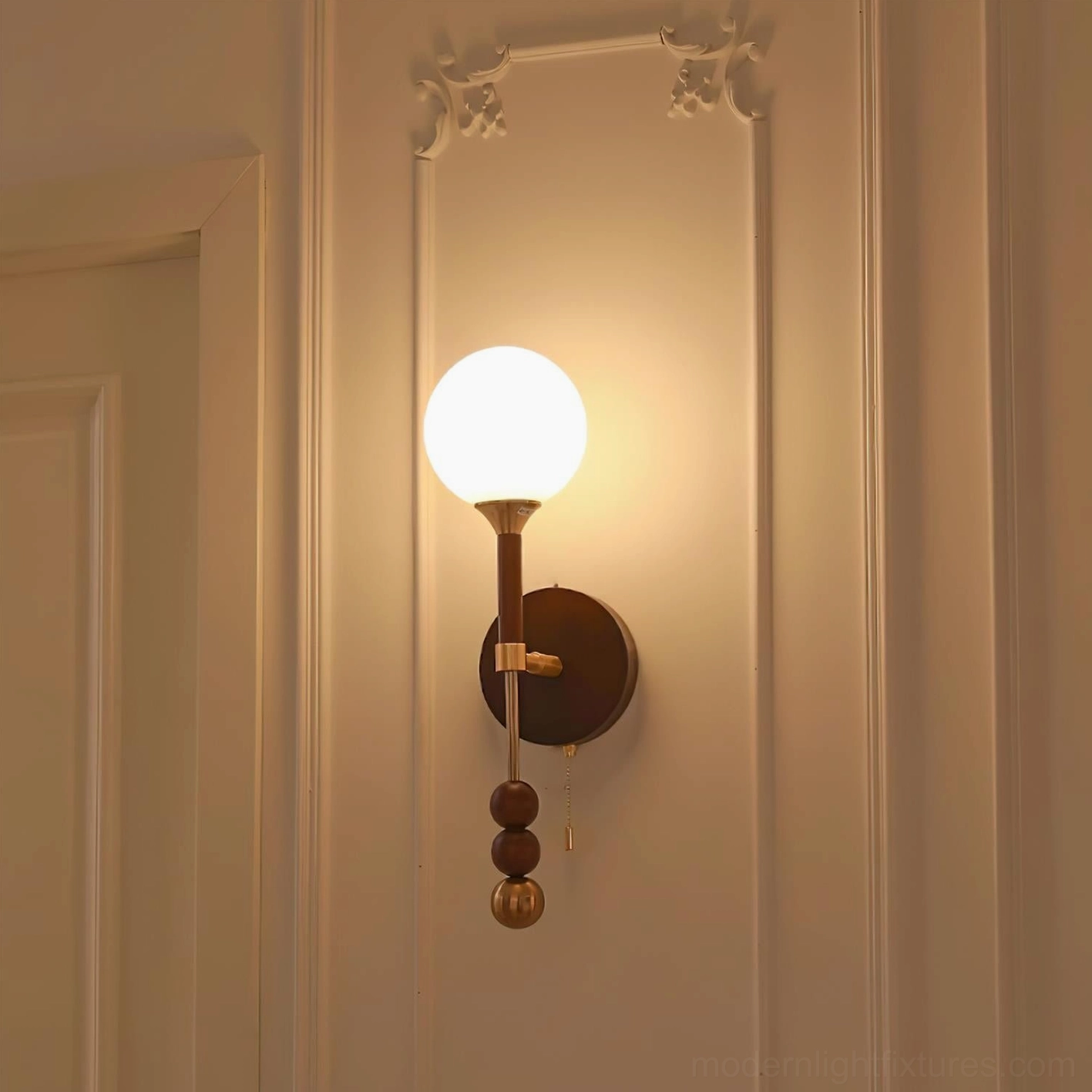 Lolli wall sconce showcase demonstrating frosted glass diffusion and decorative metal elements