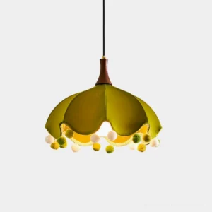 Looma fabric pendant light with scalloped shade and pom-pom trim in olive green, front view against white background