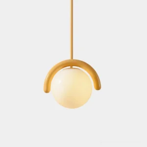 Loopin modern geometric pendant light with yellow curved bracket and frosted glass sphere, front view studio shot