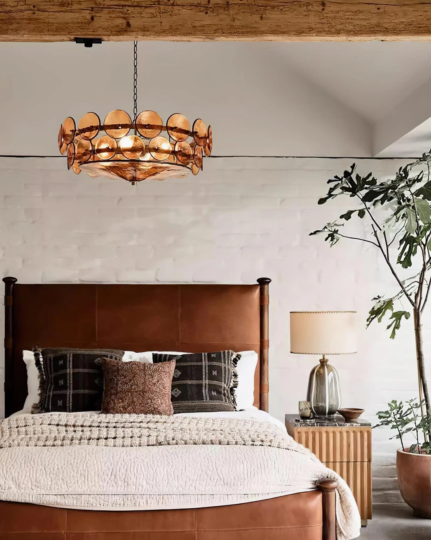 Lorenzo hand-cast glass chandelier installed in master bedroom providing warm ambient lighting