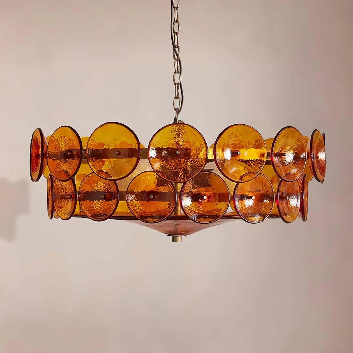 Lorenzo brass chandelier side view detail showing double row of hand-cast amber glass discs