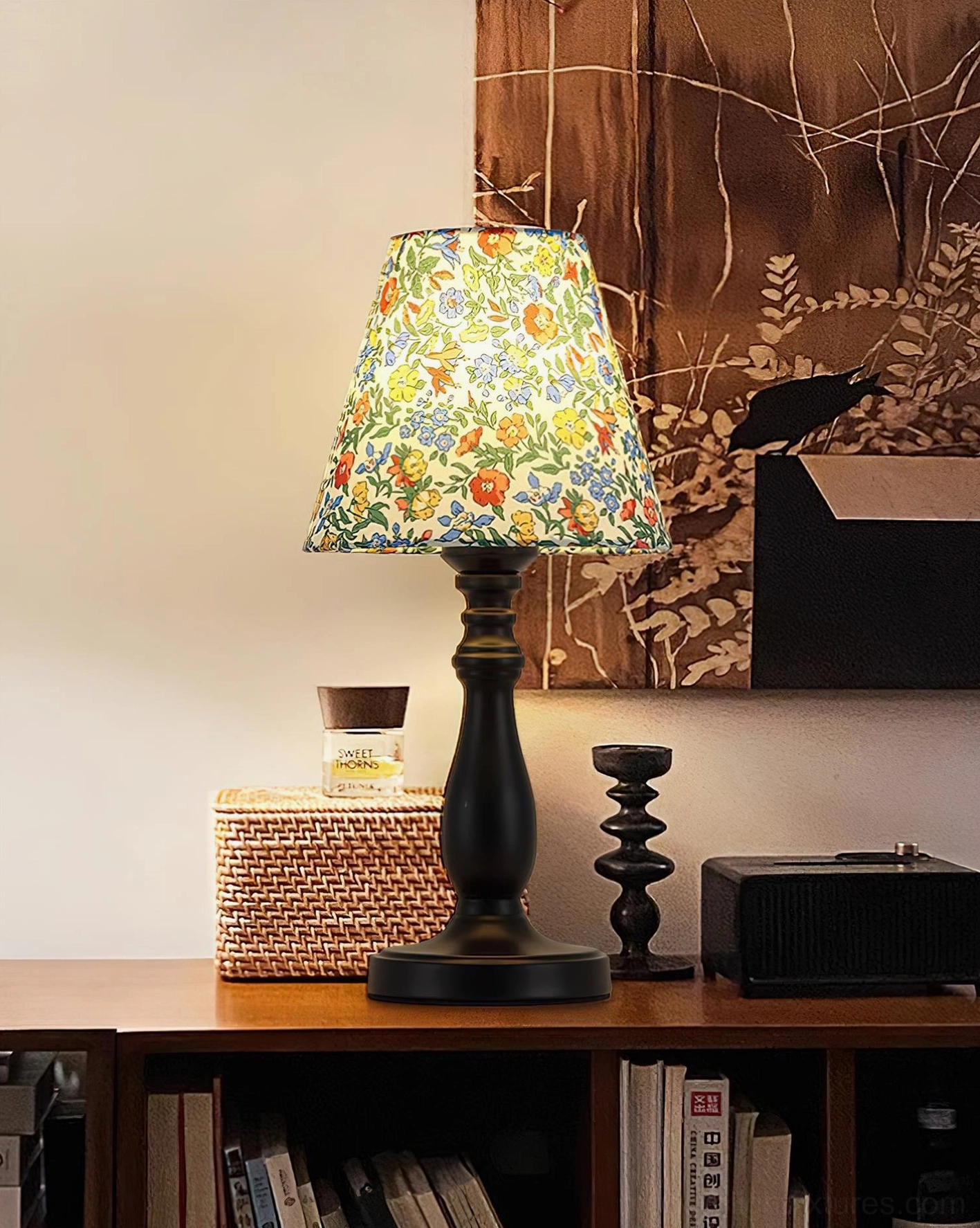 Decorative floral table lamp in vintage study with retro accessories and dark wood base