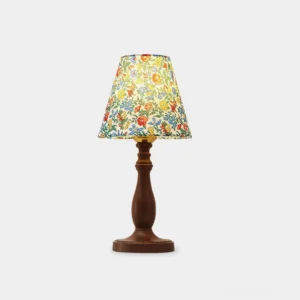 Lottie floral table lamp with vibrant botanical fabric shade and walnut wood base, front studio view